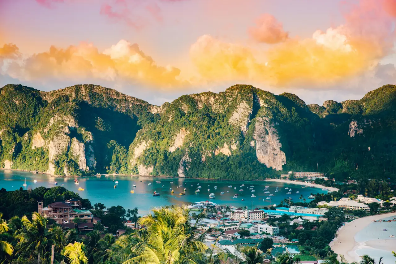 Aerial view of turquoise water and limestone islands in the Andaman Sea